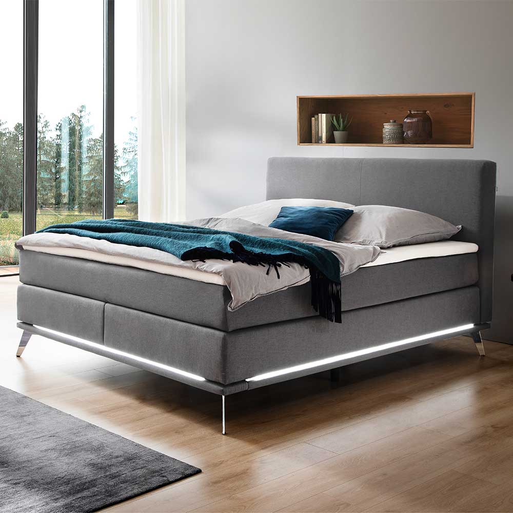 Homedreams Boxspring Bett in Hellgrau und Chrom LED Beleuchtung